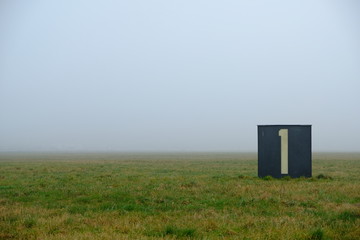 foggy field and the number one / airfield tempelhof in berlin