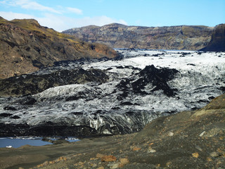 Mountains and ash covered ice on Iceland