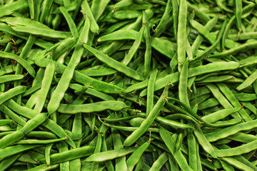 Green beans super food on market stall at organic farmers grocery store.