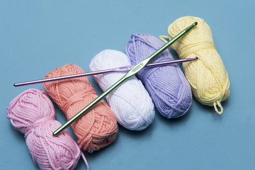 Background image of colourful yarn and crochet hooks, with copy space 