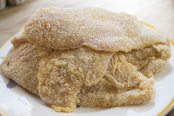 pile of slices of cutlets of chicken