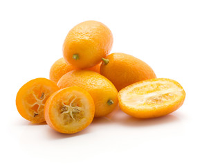 Kumquat set isolated on white background four whole three sliced halves.