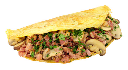 Mushroom and bacon omelette folded in half isolated on a white background