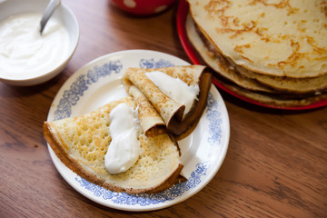 delicious pancakes with sour cream
