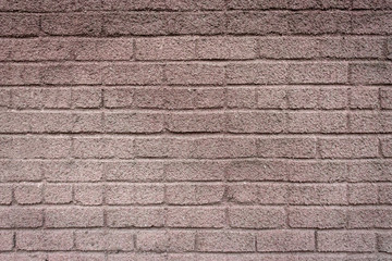 Red wall made of concrete bricks