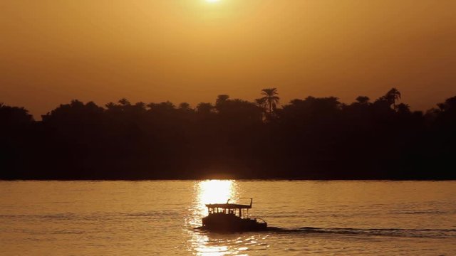 Silhouette Ferry & Sunset; Luxor & Nile; River Nile, Luxor, Egypt