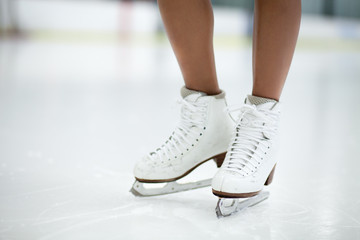 Figure Skates Close Up on Ice - obrazy, fototapety, plakaty