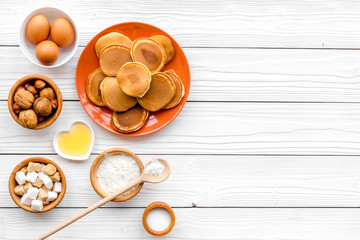 Fototapeta na wymiar Ingredients for cook american pancakes on white wooden background top view copy space