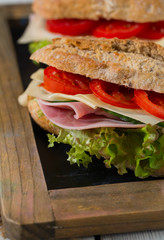 Wholegrain Ciabatta Sandwich with Lettuce, Tomatoes, Ham and Cheese