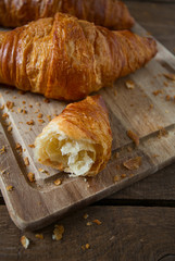 fresh croissant over wood