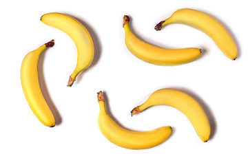Ripe yellow bananas on a white background