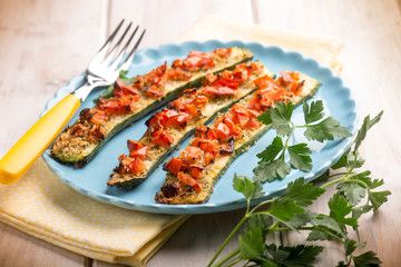 oven zucchinis with fresh tomatoes, selective focus