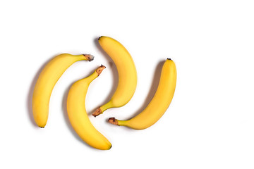 Ripe yellow bananas on a white background