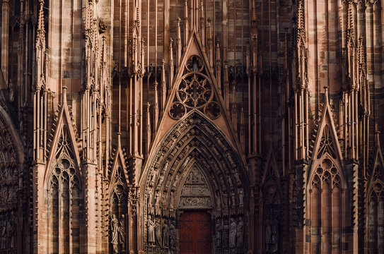 Architectural fragment of central entrance of the Strasbourg cathedral. Gothic decorative elements on Roman Catholic Cathedral. Alsace, France.
