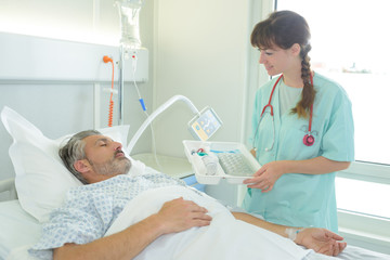 patient receiving medicine from female nurse