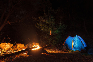 Tent campfire, camping by the river
