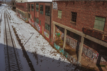 Snowy Alley with Train Tracks