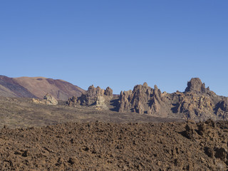 view on famous rock formation  Roques de Garcia and colorful volcanic mountain and lava desert on tenerife canary island unesco protected landscape el teide national park