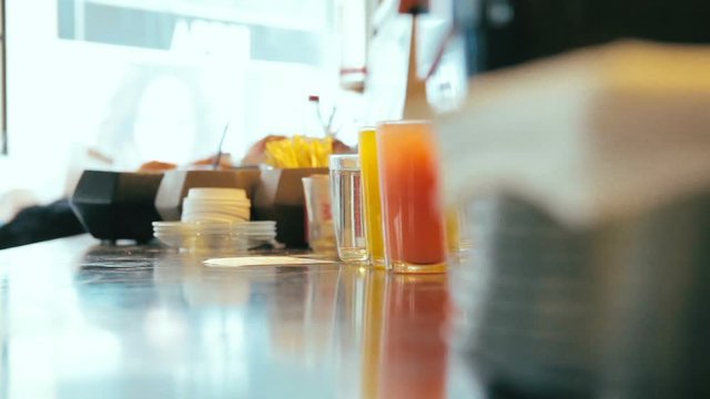 Cinemagraph of steaming hot water in glass on the counter in a cafe.