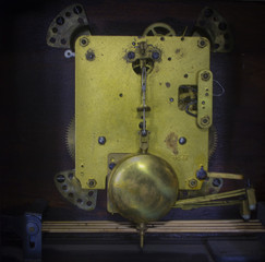 The inner mechanism of old desk striking clock