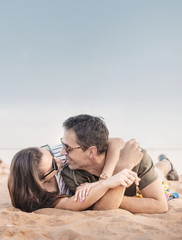 Portrait of a romantic couple relaxing on a beach