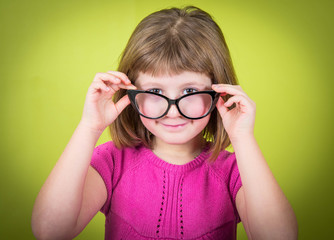 smiling little girl with glasses