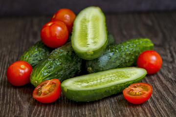 tomatoes and cucumbers are on the table