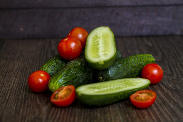 tomatoes and cucumbers are on the table
