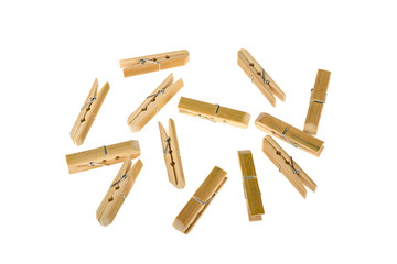 a lot of clothespins of bamboo on a white background