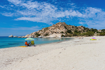 Fototapeta na wymiar Amazing Mikri Vigla beach with white sand and blue sea water on KNaxos island. Cyclades, Greece