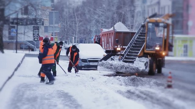 Snow removal in the city after a heavy snowfall. A lot of special equipment for snow removal.