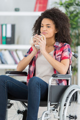 handicapped woman drinking beverage