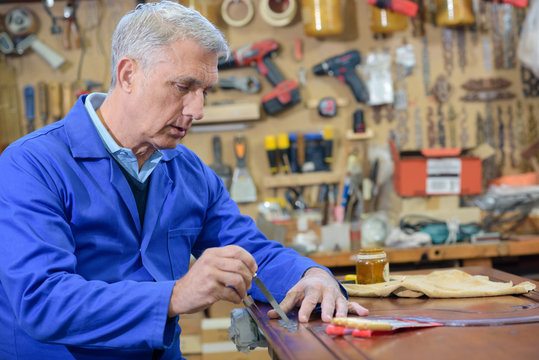 closeup of a skilled carpenter working with wood