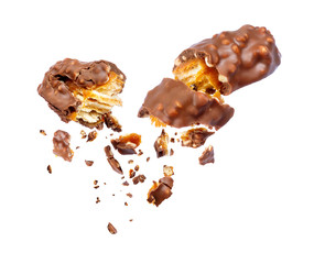 Waffle chocolate bar with nuts broken into two parts on white background