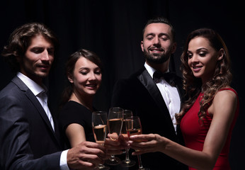 Cheerful people celebrating a sucess with Champagne