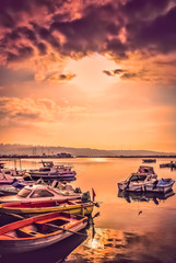 Colorful wooden fishing boats at dusk