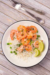 Shrimps with rice and peas. View from above, top, vertical