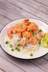 Shrimps with rice and peas. vertical
