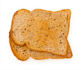 Pair of slices of fried in toaster oat bread isolated on a white background. Top view, close up.