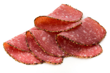 Salami slices isolated on the white background.