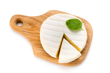 Piece of camembert cheese isolated on white background. From top view.