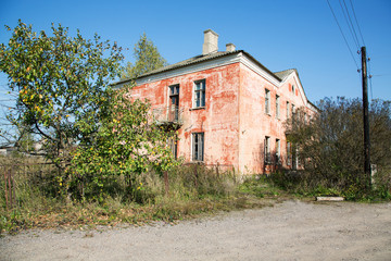 old building with broken windows and doors