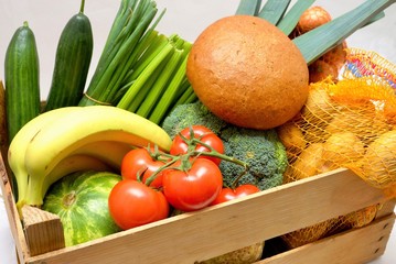 Fresh organic vegetables in a wooden crate
