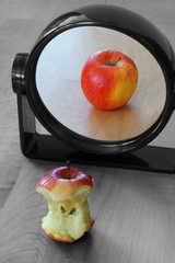 Surrealism: Apple reflecting in the mirror.  