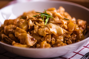 close up detail of eastern european traditional rustic dish from square pasta and cabbage 