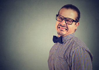 Young man looking disgusted