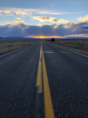 Open road going off into the sunset - 188613914