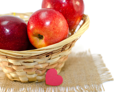 Apples on a limited background in the basket