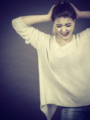 Unhappy woman screaming and yelling in pain
