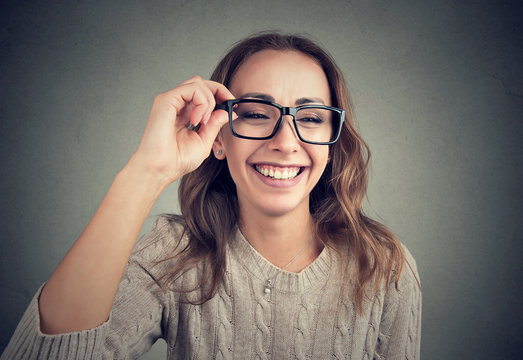 Laughing young woman in eyeglasses